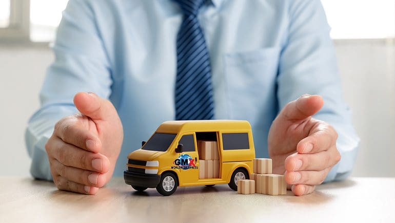 Shipping insurance for packages shipped with GMX represented by man with tie protecting toy van loaded with packages